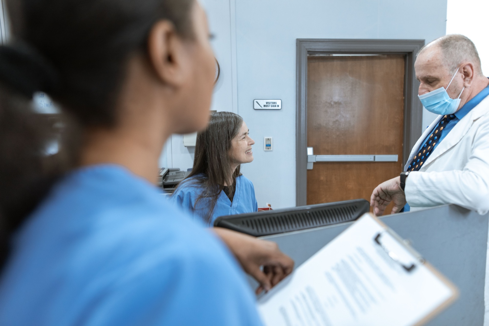 Healthcare professionals meeting in a clinical setting